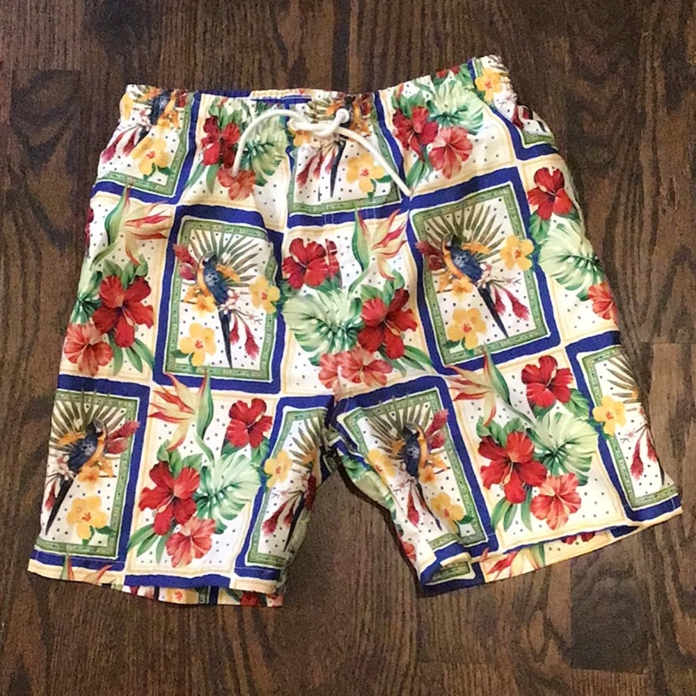 PRIMARK -  tropical parrot and flower swim shorts feature a drawstring waist.